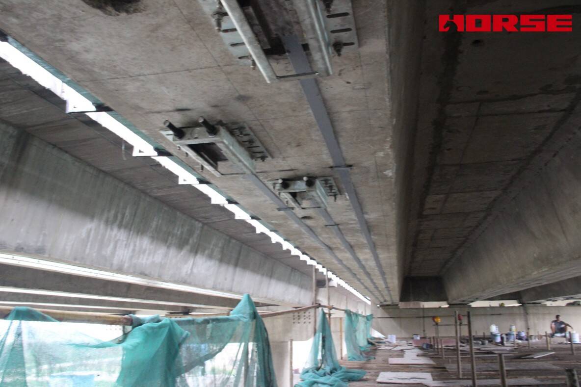 Pre-stress Carbon Fiber Laminates "Lock" Concrete Cracks