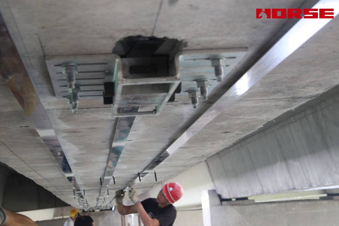 Pre-stress Carbon Fiber Laminates "Lock" Concrete Cracks